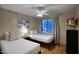 Bedroom with two twin beds, ceiling fan, hard wood floors, and flat screen television at 4008 N 85Th St, Scottsdale, AZ 85251