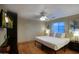 Bedroom with a king bed, mounted flat screen television, and hard wood flooring at 4008 N 85Th St, Scottsdale, AZ 85251