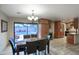 Inviting dining area with sliding glass doors with pool view and adjacent kitchen at 4008 N 85Th St, Scottsdale, AZ 85251