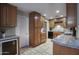 Well-equipped kitchen with wood cabinetry, granite countertops, and tile flooring at 4008 N 85Th St, Scottsdale, AZ 85251