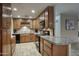 Efficient kitchen layout featuring wood cabinets, granite counters, and stainless appliances at 4008 N 85Th St, Scottsdale, AZ 85251