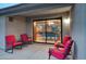 Enclosed patio features red patio furniture with a view to the interior of the home at 4008 N 85Th St, Scottsdale, AZ 85251