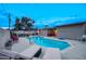 Backyard pool with lounge chairs and patio set offers a serene outdoor retreat at 4008 N 85Th St, Scottsdale, AZ 85251