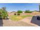 Spacious backyard with mature trees, landscaped yard and brick patio at 4100 S Dewdrop Ct, Gilbert, AZ 85297