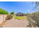 Private backyard featuring a lawn, low maintenance landscaping, and covered patio at 4100 S Dewdrop Ct, Gilbert, AZ 85297