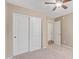 Bedroom with double closets and neutral carpeting at 4100 S Dewdrop Ct, Gilbert, AZ 85297