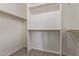 Walk-in closet provides ample storage space with built-in shelving and hanging rods at 4100 S Dewdrop Ct, Gilbert, AZ 85297