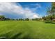 Beautiful community park with plenty of green space and mature trees at 4100 S Dewdrop Ct, Gilbert, AZ 85297