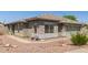 Single-story home with desert landscaping, stone accents, a two-car garage, a walkway, and neutral color scheme at 4100 S Dewdrop Ct, Gilbert, AZ 85297