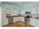 Bright white kitchen features granite countertops, stainless steel appliances, tile flooring, and a window at 4100 S Dewdrop Ct, Gilbert, AZ 85297