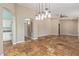 Open-concept living room features tile flooring, natural light, neutral walls, and ceiling fan at 4100 S Dewdrop Ct, Gilbert, AZ 85297