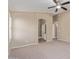 Spacious main bedroom with a ceiling fan, neutral walls, carpet and an ensuite bath at 4100 S Dewdrop Ct, Gilbert, AZ 85297