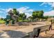 The community park has a shaded playground with slides, swings, and climbing frames at 4100 S Dewdrop Ct, Gilbert, AZ 85297