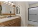 Bathroom vanity with tile backsplash and updated fixtures at 4306 E Amberwood Dr, Phoenix, AZ 85048