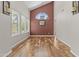 Bright dining room with hardwood floors, large windows, and elegant lighting fixture at 4306 E Amberwood Dr, Phoenix, AZ 85048