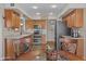Bright kitchen with stainless steel appliances and wood cabinets at 4306 E Amberwood Dr, Phoenix, AZ 85048