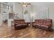 Bright living room with hardwood floors and comfortable leather furniture sets at 4306 E Amberwood Dr, Phoenix, AZ 85048