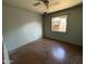 Neutral bedroom showcasing a ceiling fan, natural light, and ample space for personalization at 4310 N 42Nd Pl, Phoenix, AZ 85018