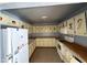 Vintage kitchen featuring white appliances, unique themed cabinetry, and ample counter space at 4310 N 42Nd Pl, Phoenix, AZ 85018