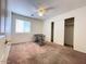 Bedroom features a window for natural light, closet, and ceiling fan at 44147 W Snow Dr, Maricopa, AZ 85138