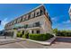 Charming townhome featuring balconies, lush landscaping, and a manicured lawn at 4438 N 27Th St # 27, Phoenix, AZ 85016
