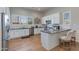 Bright kitchen with white cabinetry, stainless steel appliances, and a breakfast bar area at 4438 N 27Th St # 27, Phoenix, AZ 85016