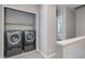 Contemporary laundry room with gray front-load washer and dryer set at 4438 N 27Th St # 27, Phoenix, AZ 85016