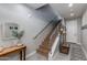 Inviting staircase with modern railing, complemented by stylish decor and a neutral color palette at 4438 N 27Th St # 27, Phoenix, AZ 85016