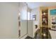 Stylish bathroom featuring a walk-in shower, and access to a closet at 46057 W Dutchman Dr, Maricopa, AZ 85139