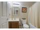Bright bathroom features a shower-tub combo with neutral tiling at 46057 W Dutchman Dr, Maricopa, AZ 85139