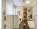 Elegant bathroom featuring a soaking tub, glass shower, and black tile flooring at 46057 W Dutchman Dr, Maricopa, AZ 85139