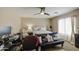 Bedroom featuring a futon, comfortable bed, and dedicated workspace at 46057 W Dutchman Dr, Maricopa, AZ 85139
