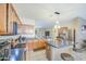 Spacious kitchen with stainless steel appliances, dark countertops and an island with barstool seating at 46057 W Dutchman Dr, Maricopa, AZ 85139