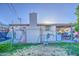 Backyard featuring a covered patio, block-wall fencing, and an attached garage at 4727 N 50Th Dr, Phoenix, AZ 85031