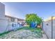 View of backyard with a covered patio, block fence and clothes line at 4727 N 50Th Dr, Phoenix, AZ 85031