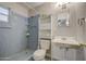 Cozy bathroom featuring a standing shower, toilet, and vanity with a mirror and cabinet for optimal storage at 4727 N 50Th Dr, Phoenix, AZ 85031