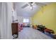 Large bedroom with yellow accent wall and gray flooring, featuring neutral decor and ample space at 4727 N 50Th Dr, Phoenix, AZ 85031