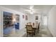 Open-concept dining area with tile floors and view into the living room with fireplace at 4727 N 50Th Dr, Phoenix, AZ 85031