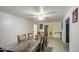 Bright dining area featuring tile flooring and an open layout to the backyard through sliding glass doors at 4727 N 50Th Dr, Phoenix, AZ 85031