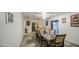 Spacious dining area with tile flooring, and neutral walls, illuminated by a ceiling fan and natural light at 4727 N 50Th Dr, Phoenix, AZ 85031