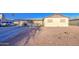 View of the house featuring a covered driveway and desert landscaping in the front yard at 4727 N 50Th Dr, Phoenix, AZ 85031
