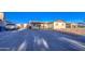 The house has a covered parking area, small front yard, and desert style landscaping at 4727 N 50Th Dr, Phoenix, AZ 85031