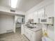 The functional kitchen offers ample cabinet space and tile flooring extending into a secondary area at 4727 N 50Th Dr, Phoenix, AZ 85031