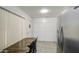 A bright and cozy kitchen nook with a view, plenty of storage, and stainless steel refrigerator at 4727 N 50Th Dr, Phoenix, AZ 85031