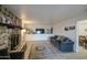Living room with tile flooring, stone fireplace, and modern decor at 4727 N 50Th Dr, Phoenix, AZ 85031