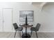 Intimate dining area with modern chairs and a decorative painting on the wall at 4901 S Calle Los Cerros Dr # 237, Tempe, AZ 85282