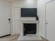 Cozy fireplace is equipped with TV mount and next to entry for convenience at 4901 S Calle Los Cerros Dr # 237, Tempe, AZ 85282