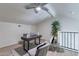 Bright office space with a desk, seating, a ceiling fan, and a view of the railing at 4901 S Calle Los Cerros Dr # 237, Tempe, AZ 85282