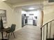Open view of kitchen with white cabinets and stainless steel appliances from dining area at 4901 S Calle Los Cerros Dr # 237, Tempe, AZ 85282