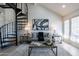 Bright living room features a spiral staircase, modern decor, and lots of natural light at 4901 S Calle Los Cerros Dr # 237, Tempe, AZ 85282